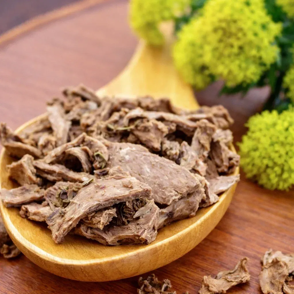 Dried rhodiola root pieces in a wooden bowl